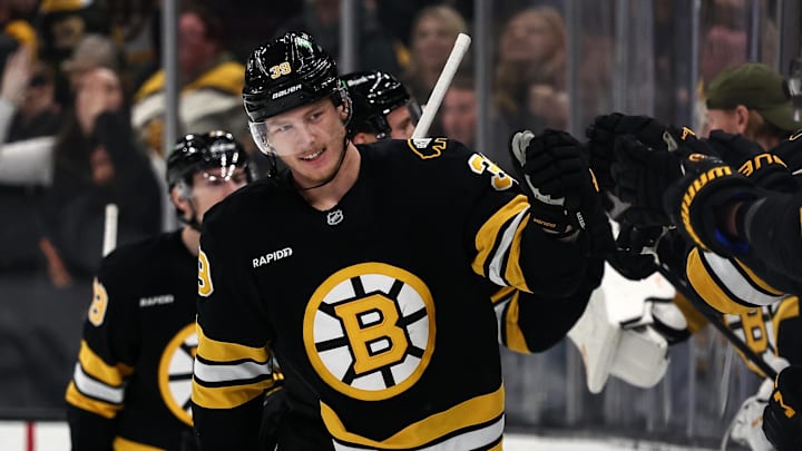 Nov 29, 2025; Boston, Massachusetts, USA; Boston Bruins center Morgan Geekie (39) is congratulated by teammates on the bench after scoring against the Detroit Red Wings during the second period at TD Garden. Mandatory Credit: Winslow Townson-Imagn Images
