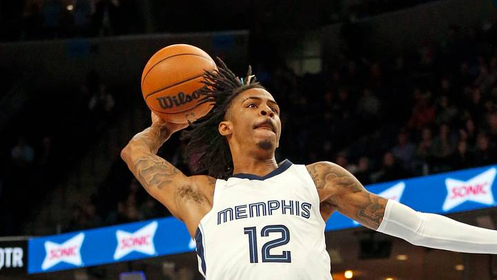 Nov 24, 2021; Memphis, Tennessee, USA; Memphis Grizzles guard Ja Morant (12) dunks during the second half against the Toronto Raptors at FedExForum. Mandatory Credit: Petre Thomas-USA TODAY Sports Nov 24, 2021; Memphis, Tennessee, USA; Memphis Grizzles guard Ja Morant (12) dunks during the second half against the Toronto Raptors at FedExForum. Mandatory Credit: Petre Thomas-USA TODAY Sports