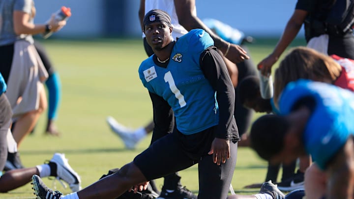 Jacksonville Jaguars running back Travis Etienne Jr. (1) stretches during training camp Monday, Aug.