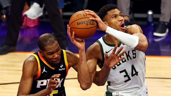 Feb 6, 2024; Phoenix, Arizona, USA; Milwaukee Bucks forward Giannis Antetokounmpo (34) drives to the basket against Phoenix Suns forward Kevin Durant (35) during the second quarter at Footprint Center. Mandatory Credit: Mark J. Rebilas-Imagn Images Feb 6, 2024; Phoenix, Arizona, USA; Milwaukee Bucks forward Giannis Antetokounmpo (34) drives to the basket against Phoenix Suns forward Kevin Durant (35) during the second quarter at Footprint Center. Mandatory Credit: Mark J. Rebilas-Imagn Images