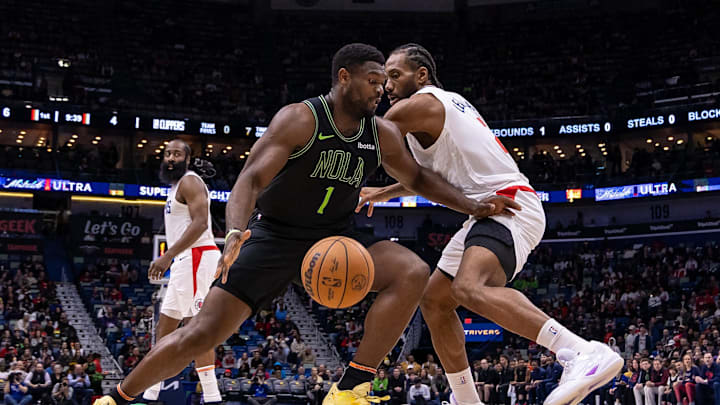 Jan 5, 2024; New Orleans, Louisiana, USA;  New Orleans Pelicans forward Zion Williamson (1) dribbles against LA Clippers forward Kawhi Leonard (2) during the first half at Smoothie King Center. Mandatory Credit: Stephen Lew-Imagn Images