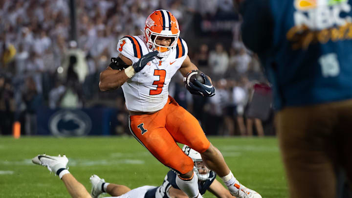Illinois running back Kaden Feagin (3) runs near the sideline while carrying the ball in the first quarter of a Big Ten football game against Penn State, Saturday, Sept. 28, 2024, in State College, Pa.
