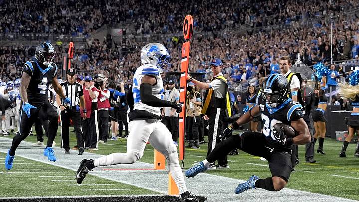 Oct 4, 2026; Charlotte, North Carolina, USA; Carolina Panthers running back Chuba Hubbard (30) scores a touchdown defended by Detroit Lions safety Chuck Clark (36) during the first quarter at Bank of America Stadium. Mandatory Credit: Jim Dedmon-Imagn Images TPX IMAGES OF THE DAY Oct 4, 2026; Charlotte, North Carolina, USA; Carolina Panthers running back Chuba Hubbard (30) scores a touchdown defended by Detroit Lions safety Chuck Clark (36) during the first quarter at Bank of America Stadium. Mandatory Credit: Jim Dedmon-Imagn Images TPX IMAGES OF THE DAY