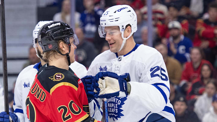 Mar 21, 2026; Ottawa, Ontario, CAN; Ottawa Senators left wing Fabian Zetterlund (20) exchanges words with Toronto Maple Leafs defenseman Brandon Carlo (25) in the first period at the Canadian Tire Centre. Mandatory Credit: Marc DesRosiers-IMAGN Images