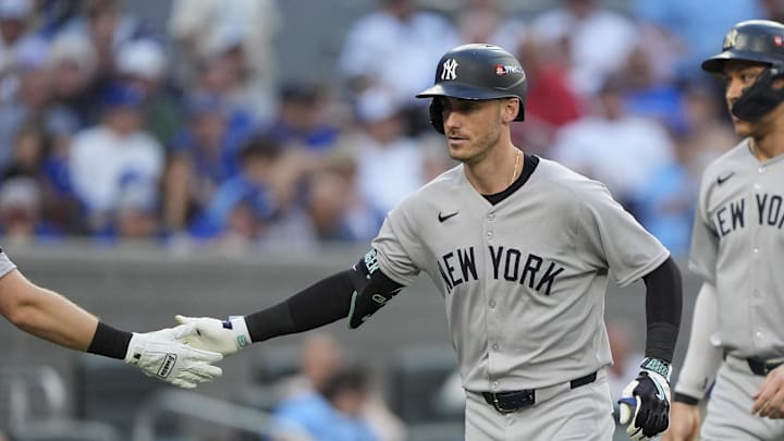 Oct 5, 2025; Toronto, Ontario, CAN; New York Yankees Cody Bellinger (35) is congratulated after hitting a two-run home run in the sixth inning against the Toronto Blue Jays during game two of the ALDS round for the 2025 MLB playoffs at Rogers Centre. Mandatory Credit: John E. Sokolowski-Imagn Images Oct 5, 2025; Toronto, Ontario, CAN; New York Yankees Cody Bellinger (35) is congratulated after hitting a two-run home run in the sixth inning against the Toronto Blue Jays during game two of the ALDS round for the 2025 MLB playoffs at Rogers Centre. Mandatory Credit: John E. Sokolowski-Imagn Images