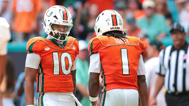 Oct 24, 2026; Miami Gardens, Florida, USA; Miami Hurricanes wide receiver Malachi Toney (1) celebrates with quarterback Darian Mensah (10) after scoring a touchdown against the Pittsburgh Panthers during the second quarter at Hard Rock Stadium. Mandatory Credit: Sam Navarro-Imagn Images