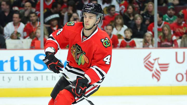 Mar 29, 2013; Chicago, IL, USA; Chicago Blackhawks defenseman Niklas Hjalmarsson (4) with the puck during the first period against the Anaheim Ducks at the United Center. Mandatory Credit: Dennis Wierzbicki-USA TODAY Sports