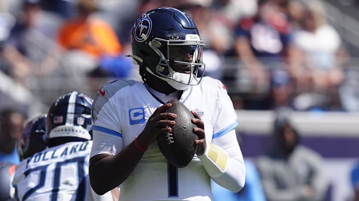 Sep 7, 2025; Denver, Colorado, USA; Tennessee Titans quarterback Cam Ward (1) drops back to pass against the Denver Broncos during the first half at Empower Field at Mile High. Mandatory Credit: Ron Chenoy-Imagn Images