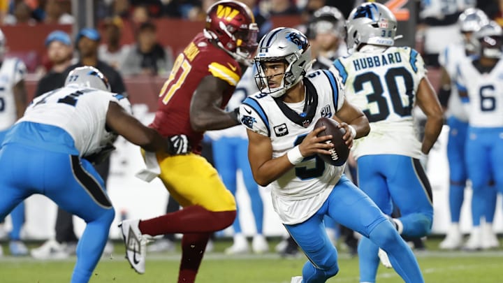 Oct 20, 2024; Landover, Maryland, USA; Carolina Panthers quarterback Bryce Young (9) scrambles against the Washington Commanders during the fourth quarter at Northwest Stadium. Mandatory Credit: Geoff Burke-Imagn Images