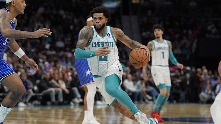 Oct 30, 2025; Charlotte, North Carolina, USA; Charlotte Hornets forward Miles Bridges drives to the basket against Orlando Magic forward Paolo Banchero (5) during the second half at Spectrum Center. Mandatory Credit: Jim Dedmon-Imagn Images Oct 30, 2025; Charlotte, North Carolina, USA; Charlotte Hornets forward Miles Bridges drives to the basket against Orlando Magic forward Paolo Banchero (5) during the second half at Spectrum Center. Mandatory Credit: Jim Dedmon-Imagn Images