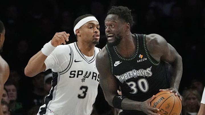 May 10, 2026; Minneapolis, Minnesota, USA; Minnesota Timberwolves forward Julius Randle (30) works around San Antonio Spurs forward Keldon Johnson (3) in the first quarter of game four of the second round of the 2026 NBA Playoffs at Target Center. Mandatory Credit: Bruce Kluckhohn-Imagn Images