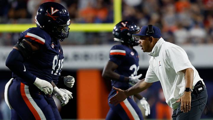Sep 14, 2024; Charlottesville, Virginia, USA; Virginia Cavaliers head coach Tony Elliott encourages his team during a change of possession against the Maryland Terrapins during the first half at Scott Stadium. Mandatory Credit: Geoff Burke-Imagn Images Sep 14, 2024; Charlottesville, Virginia, USA; Virginia Cavaliers head coach Tony Elliott encourages his team during a change of possession against the Maryland Terrapins during the first half at Scott Stadium. Mandatory Credit: Geoff Burke-Imagn Images