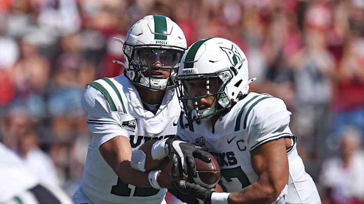 Aug 31, 2024; Pullman, Washington, USA; Portland State Vikings quarterback Dante Chachere (15) hands the ball off to Portland State Vikings running back Quincy Craig (17) during a game against the Washington State Cougars in the first half at Gesa Field at Martin Stadium. Mandatory Credit: James Snook-USA TODAY Sports
