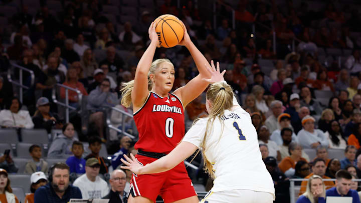 Mar 28, 2026; Fort Worth, TX, USA;  Louisville Cardinals forward Laura Ziegler (0) controls the ball as Michigan Wolverines defends during the first half at Dickies Arena. Mandatory Credit: Chris Jones-Imagn Images