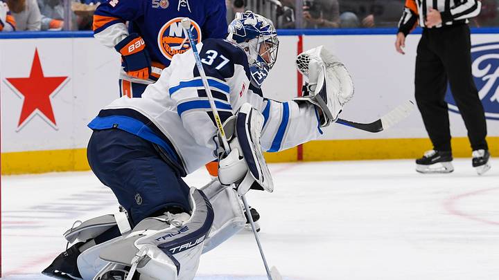 Feb 22, 2023; Elmont, New York, USA; Winnipeg Jets goaltender Connor Hellebuyck (37) makes a glove save against the New York Islanders during the second period at UBS Arena. Mandatory Credit: Dennis Schneidler-USA TODAY Sports Feb 22, 2023; Elmont, New York, USA; Winnipeg Jets goaltender Connor Hellebuyck (37) makes a glove save against the New York Islanders during the second period at UBS Arena. Mandatory Credit: Dennis Schneidler-USA TODAY Sports