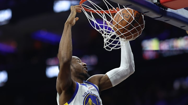 Dec 4, 2025; Philadelphia, Pennsylvania, USA; Golden State Warriors forward Jonathan Kuminga (1) dunks the ball against the Philadelphia 76ers during the third quarter at Xfinity Mobile Arena. Mandatory Credit: Bill Streicher-Imagn Images