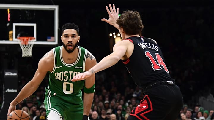 Jan 29, 2025; Boston, Massachusetts, USA; Boston Celtics forward Jayson Tatum (0) controls the ball while Chicago Bulls forward Matas Buzelis (14) defends during the first half at TD Garden. Mandatory Credit: Bob DeChiara-Imagn Images
