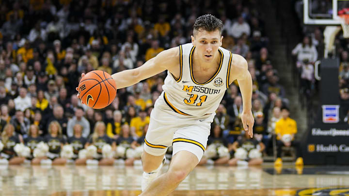 Feb 8, 2025; Columbia, Missouri, USA; Missouri Tigers guard Caleb Grill (31) drives during the first half against the Texas A&M Aggies at Mizzou Arena. Mandatory Credit: Jay Biggerstaff-Imagn Images