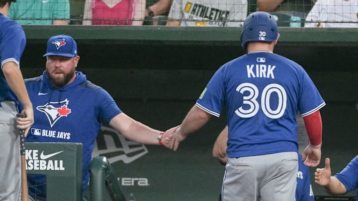 Jul 11, 2025; West Sacramento, California, USA; Toronto Blue Jays catcher Alejandro Kirk (30) celebrates with manager John Schneider (14) after scoring against the Athletics during the fifth inning at Sutter Health Park. 