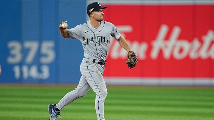Seattle Mariners second baseman Adam Frazier completes a throw-out against the Toronto Blue Jays on Oct. 8, 2022, at Rogers Centre.