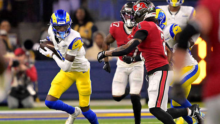 Nov 23, 2025; Inglewood, California, USA; Los Angeles Rams cornerback Emmanuel Forbes Jr. (1) runs the ball after an interception against the Tampa Bay Buccaneers at SoFi Stadium. Mandatory Credit: Jayne Kamin-Oncea-Imagn Images