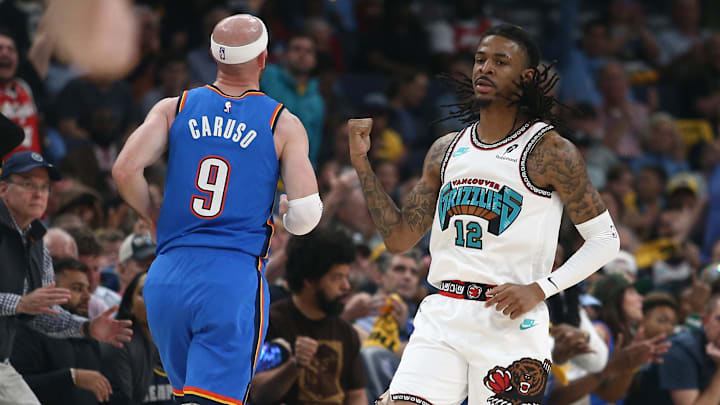 Apr 24, 2025; Memphis, Tennessee, USA; Memphis Grizzlies guard Ja Morant (12) reacts after a three point basket during the second quarter against the Oklahoma City Thunder during game three for the first round of the 2024 NBA Playoffs at FedExForum. Mandatory Credit: Petre Thomas-Imagn Images Apr 24, 2025; Memphis, Tennessee, USA; Memphis Grizzlies guard Ja Morant (12) reacts after a three point basket during the second quarter against the Oklahoma City Thunder during game three for the first round of the 2024 NBA Playoffs at FedExForum. Mandatory Credit: Petre Thomas-Imagn Images