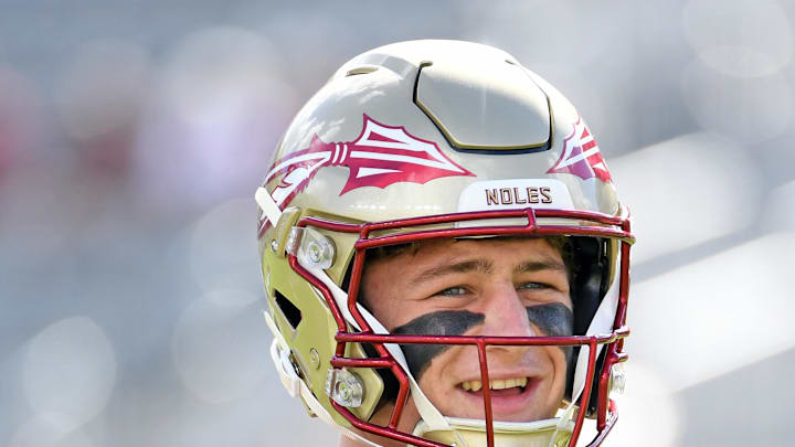 Nov 2, 2024; Tallahassee, Florida, USA;  Florida State Seminoles quarterback Luke Kromenhoek (14) warms up before a game against the North Carolina Tarheels at Doak S. Campbell Stadium. Mandatory Credit: Robert Myers-Imagn Images