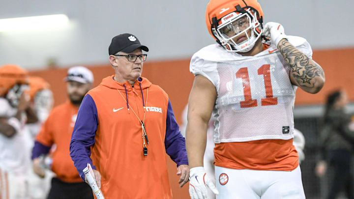 Clemson defensive coordinator Tom Allen near defensive lineman Peter Woods (11) during the football practice at the Allen N. Reeves Football Complex at Clemson University in Clemson, S.C. Wednesday, March 5, 2025.