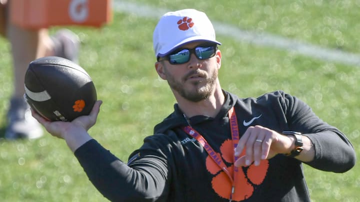 Clemson wide receiver coach Tyler Grisham passes during the first football practice at the Allen N. Reeves Football Complex at Clemson University in Clemson, S.C. Friday, February 28, 2025.