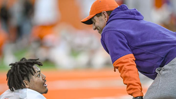 Clemson defensive end T.J. Parker (3) speaks with Clemson head coach Dabo Swinney during the football practice at the Allen N. Reeves Football Complex at Clemson University in Clemson, S.C. Wednesday, March 5, 2025.