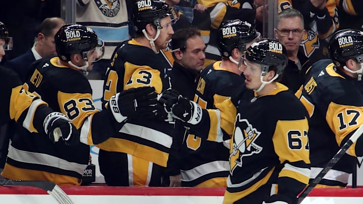 Nov 30, 2024; Pittsburgh, Pennsylvania, USA;  Pittsburgh Penguins right wing Rickard Rakell (67) celebrates his goal with the Penguins bench against the Calgary Flames during the third period at PPG Paints Arena. Mandatory Credit: Charles LeClaire-Imagn Images