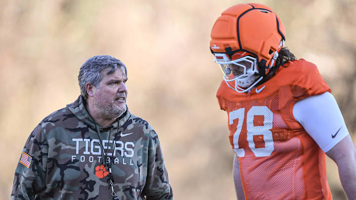 Clemson offensive line coach Matt Luke talks with offensive lineman Blake Miller (78) during the football practice at the Allen N. Reeves Football Complex at Clemson University in Clemson, S.C. Monday, March 3, 2025.
