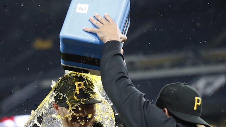 May 11, 2024; Pittsburgh, Pennsylvania, USA; Pittsburgh Pirates pitcher Martín Pérez (right) pours Gatorade on Paul Skenes.