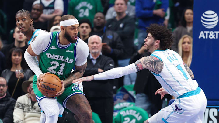 Jan 29, 2026; Dallas, Texas, USA; Dallas Mavericks forward Daniel Gafford (21) controls the ball as Charlotte Hornets guard LaMelo Ball (1) defends  during the first quarter at American Airlines Center. Mandatory Credit: Kevin Jairaj-Imagn Images