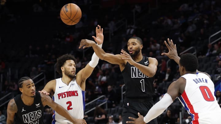 Mar 7, 2024; Detroit, Michigan, USA; Brooklyn Nets forward Mikal Bridges (1) punts the ball past Detroit Pistons guard Cade Cunningham (2) in the second half at Little Caesars Arena. Mandatory Credit: Rick Osentoski-USA TODAY Sports