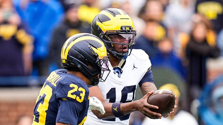 Michigan quarterback Bryce Underwood (19) hands the ball to Team Blue running back Jordan Marshall (23) during the spring game at Michigan Stadium in Ann Arbor on Saturday, April 18, 2026.