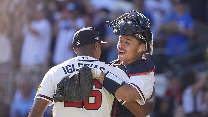 Sep 29, 2026; Cumberland, Georgia, USA;  Atlanta Braves pitcher Raisel Iglesias (26) and catcher Drake Baldwin (30) react after the game during game one of the Wildcard round for the 2026 MLB Playoffs at Truist Park.  Mandatory Credit: Dale Zanine-Imagn Images