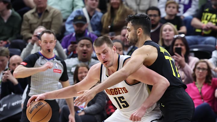 Apr 9, 2024; Salt Lake City, Utah, USA; Utah Jazz center Omer Yurtseven (77) defends Denver Nuggets