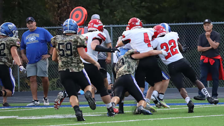 Cambridge battled Bellaire in Buckeye 8 action Friday at McFarland Stadium.
