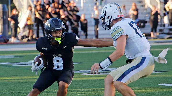 Gateway receiver Jayden Stammer attempts to get around Kiski Area's Ladyn Artman Friday night at Antimarino Stadium in Monroeville, Pennsylvania. The Gators picked up their first season-opening win since 2022 by beating the Cavaliers 31-10.