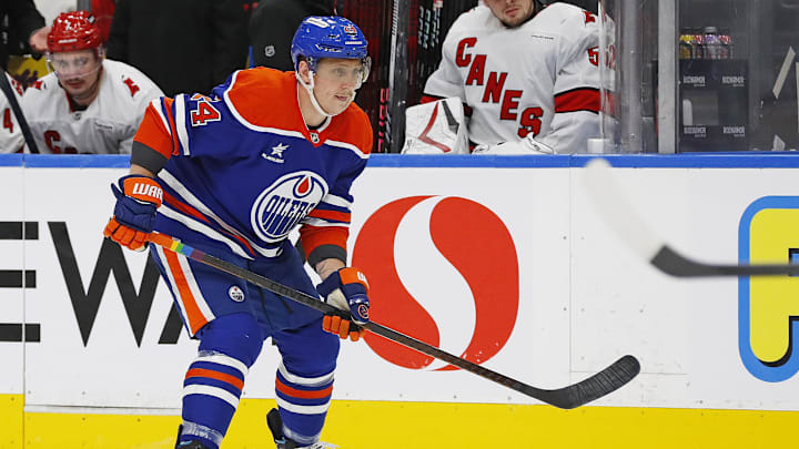Oct 22, 2024; Edmonton, Alberta, CAN; Edmonton Oilers defensemen Travis Dermott (24) follows the play against the Carolina Hurricanes at Rogers Place. Mandatory Credit: Perry Nelson-Imagn Images