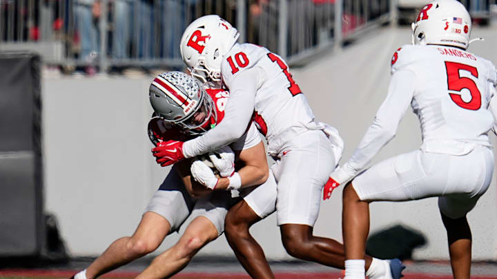 Ohio State Buckeyes wide receiver David Adolph (82) runs into Rutgers Scarlet Knights defensive back Jacobie Henderson (10) during the NCAA football game at Ohio Stadium in Columbus on Nov. 22, 2025. Ohio State won 42-9.