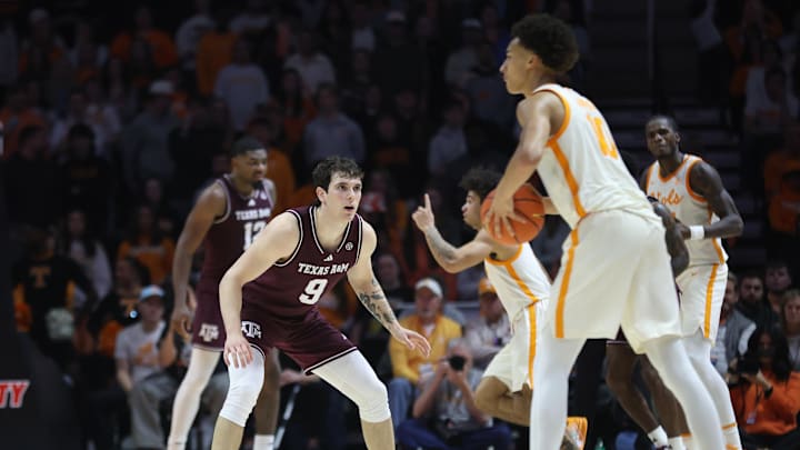 Jan 13, 2026; Knoxville, Tennessee, USA;  Texas A&M Aggies guard Ruben Dominguez (9) defends Tennessee Volunteers forward Nate Ament (10) during the second half at Thompson-Boling Arena at Food City Center. Mandatory Credit: Randy Sartin-Imagn Images