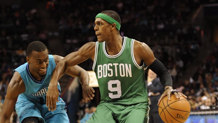 Dec 10, 2014; Charlotte, NC, USA; Boston Celtics guard Rajon Rondo (9) drives against Charlotte Hornets guard Kemba Walker (15) during the second half of the game at Time Warner Cable Arena. Hornets win 96-87. Mandatory Credit: Sam Sharpe-Imagn Images