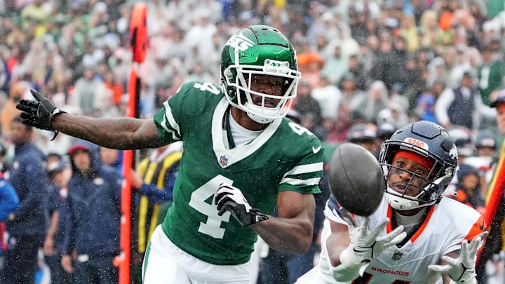 Sep 29, 2024; East Rutherford, New Jersey, USA;  Denver Broncos wide receiver Courtland Sutton (14) can not hang on to a pass as New York Jets cornerback D.J. Reed (4) defends during the first quarter at MetLife Stadium. Mandatory Credit: Robert Deutsch-Imagn Images