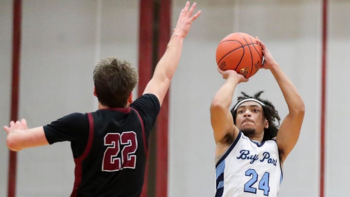 Bay Port High School's AJ Ivy (24) shoots a 3-pointer against De Pere High School on Friday, December 19, 2025, at De Pere High School in De Pere, Wis. De Pere won the game, 80-52.
Tork Mason/USA TODAY NETWORK-Wisconsin