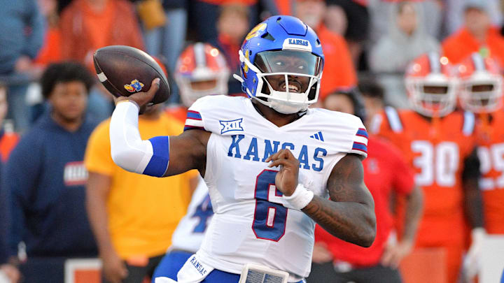 Sep 7, 2024; Champaign, Illinois, USA; Kansas Jayhawks quarterback Jalon Daniels (6) passes the ball against the Illinois Fighting Illini during the first half at Memorial Stadium. Sep 7, 2024; Champaign, Illinois, USA; Kansas Jayhawks quarterback Jalon Daniels (6) passes the ball against the Illinois Fighting Illini during the first half at Memorial Stadium.