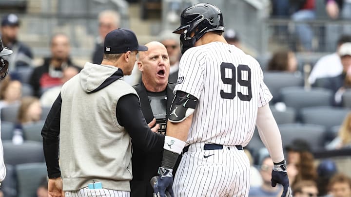 May 4, 2024; Bronx, New York, USA;  New York Yankees center fielder Aaron Judge (99) and manager