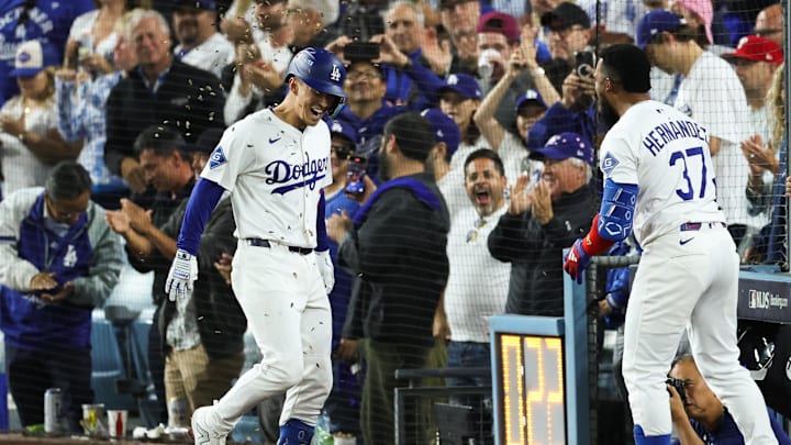 Oct 8, 2025; Los Angeles, California, USA; Los Angeles Dodgers second baseman Tommy Edman (25) celebrates after hitting a solo home run during the third inning against the Philadelphia Phillies during game three of the NLDS round for the 2025 MLB playoffs at Dodger Stadium. Mandatory Credit: Kiyoshi Mio-Imagn Images