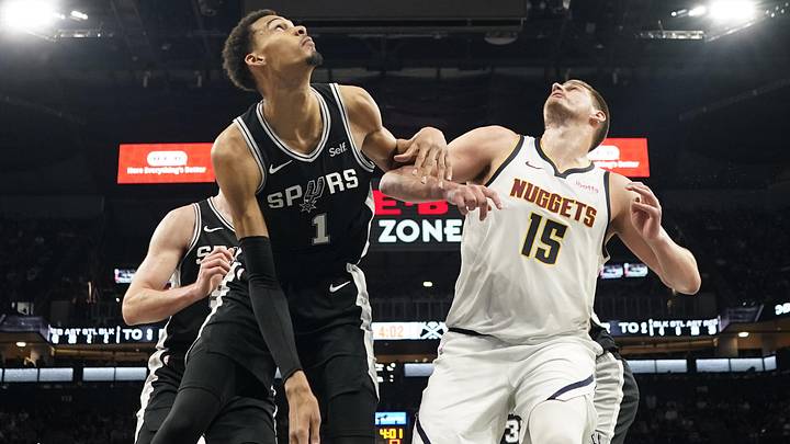 Apr 12, 2024; San Antonio, Texas, USA; Denver Nuggets center Nikola Jokic (15) and San Antonio Spurs forward Victor Wembanyama (1) box out for a rebound during the second half at Frost Bank Center. Apr 12, 2024; San Antonio, Texas, USA; Denver Nuggets center Nikola Jokic (15) and San Antonio Spurs forward Victor Wembanyama (1) box out for a rebound during the second half at Frost Bank Center.
